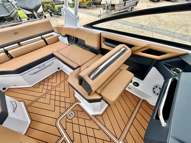 Slide: The Image of The image shows the luxurious cockpit of a 2027 Cobalt R4 boat with elegant seating. - 37