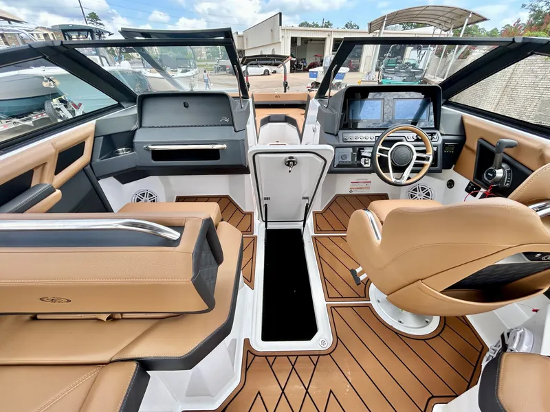 Slide: The Image of The 2027 Cobalt R4 cockpit features luxurious seating and a modern dashboard. - 34