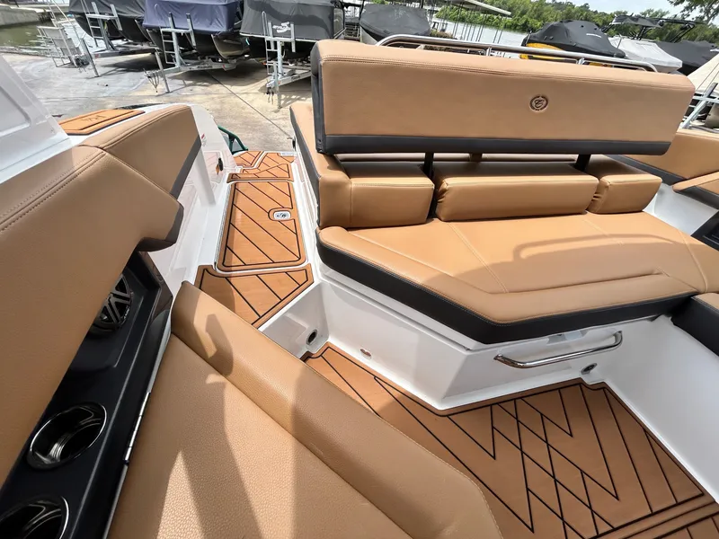 Slide: The Image of The image shows the luxurious cockpit of a Cobalt R4 boat with sleek brown upholstery. - 47
