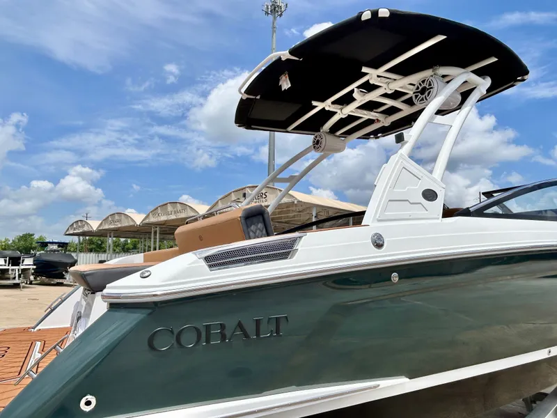 Slide: The Image of A 2027 Cobalt R4 boat with sleek design and a black sunshade. - 9