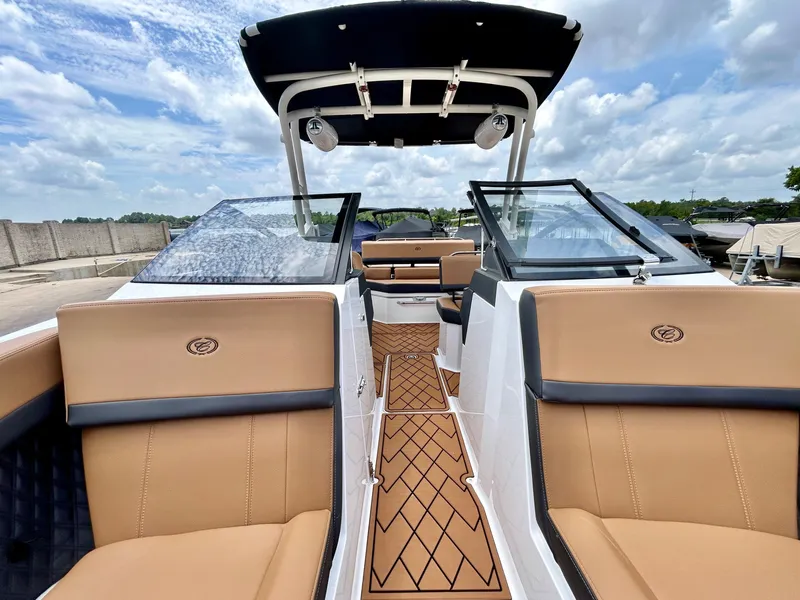 Slide: The Image of The image shows the cockpit of a 2027 Cobalt R4 boat with beige seats and a black canopy. - 21