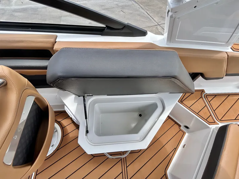 Slide: The Image of The image shows the interior of a 2027 Cobalt R4 boat with an open storage compartment. - 46