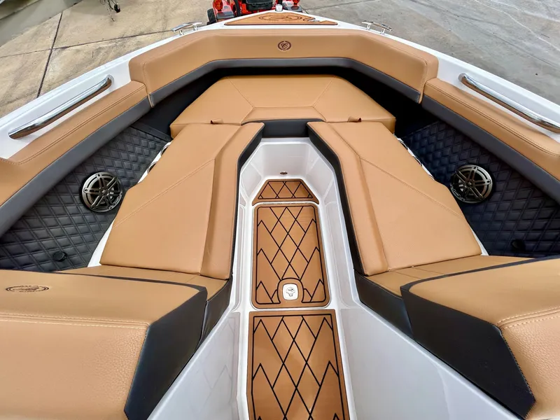 Slide: The Image of The image shows the bow of a Cobalt R4 boat with elegant brown upholstery and stylish details. - 19