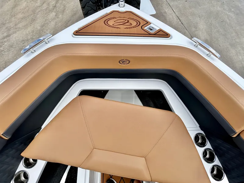 Slide: The Image of The image shows the bow of a Cobalt R4 boat with brown upholstery and stainless steel cup holders. - 20