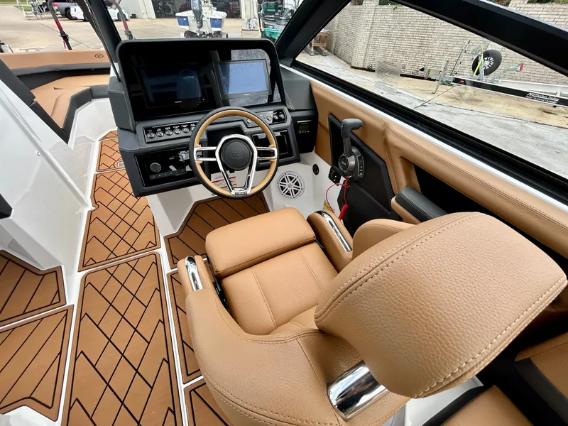 Slide: The Image of The image shows the cockpit of a Cobalt R4 boat with a modern helm and beige seating. - 31