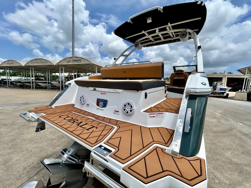 Slide: The Image of The image shows a modern 2027 Cobalt R4 boat with a stylish deck and comfortable seating. - 13