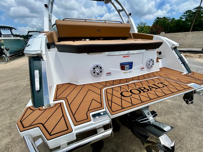 Slide: The Image of The image shows the stern of a 2027 Cobalt R4 boat with sleek wood accents. - 15