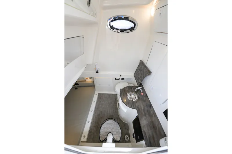 Slide: The Image of 2022 Regulator 34 Center Console interior with sink, toilet, and modern design. - 30