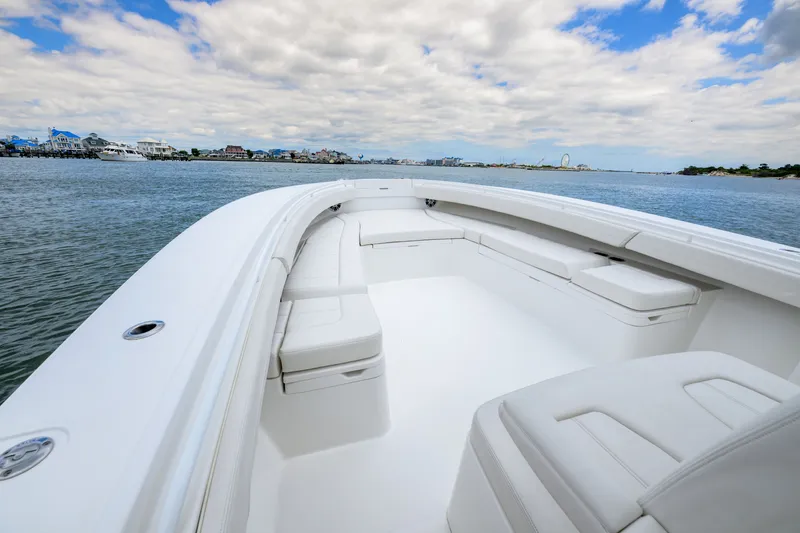 Slide: The Image of 2022 Regulator 34 Center Console boat with spacious seating on calm water. - 29