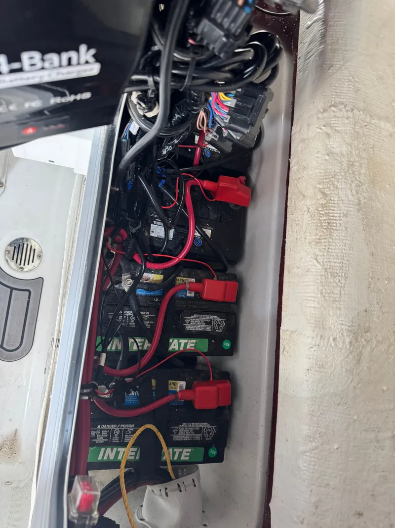 Slide: The Image of Batteries and wiring inside a boat, neatly arranged and secured. - 23