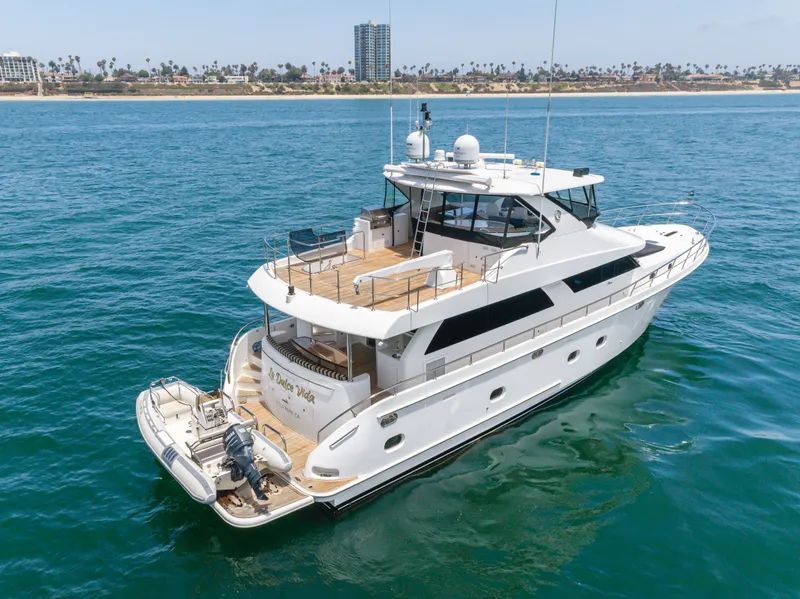 Slide: The Image of A luxurious white yacht with multiple decks sails on calm waters. The coastline is visible in the background. - 5