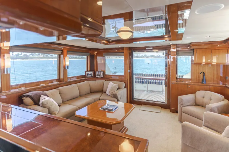 Slide: The Image of Luxurious salon of a 2010 Ocean Alexander 68 Motor Yacht with comfortable sofas and panoramic windows. - 27