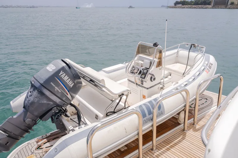 Slide: The Image of A tender with a Yamaha outboard motor is secured on a yacht's deck. - 19