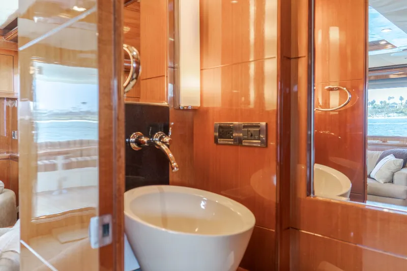 Slide: The Image of Luxurious bathroom with wood paneling, modern sink, and fixtures on a yacht. - 29