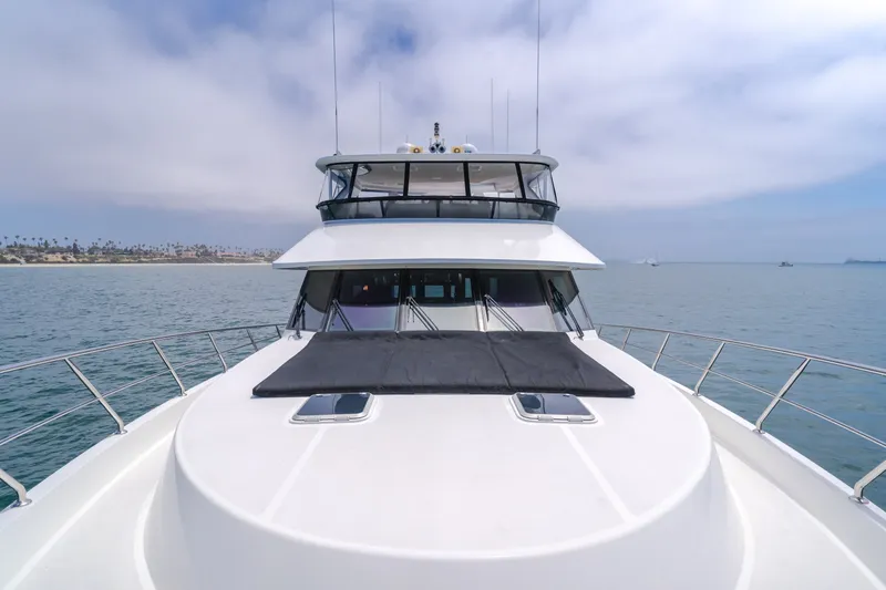 Slide: The Image of The 2010 Ocean Alexander 68 Motor Yacht cruises on calm waters with a clear sky in the background. - 17
