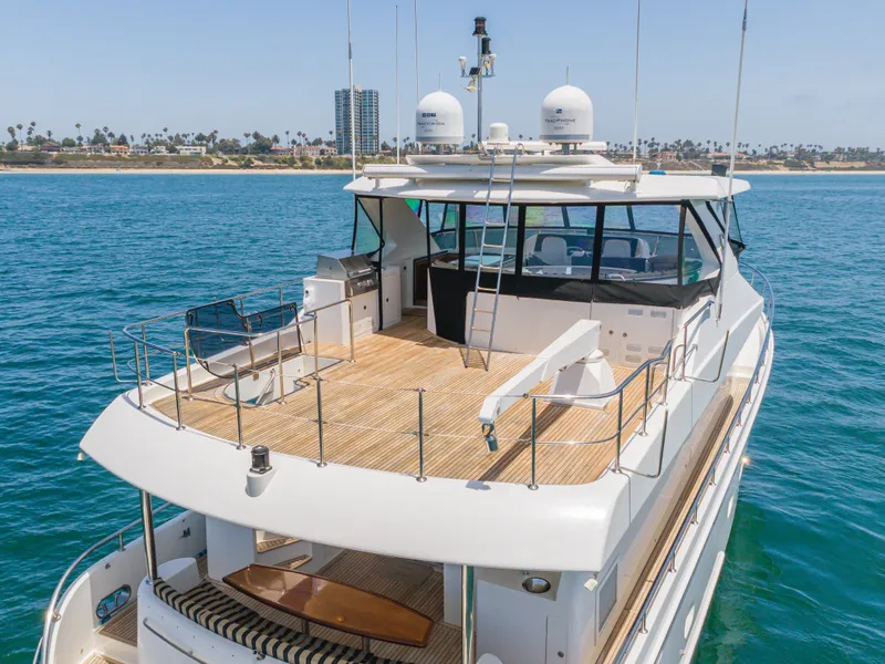 Slide: The Image of The 2010 Ocean Alexander 68 Motor Yacht features a spacious deck with elegant wooden flooring. - 7