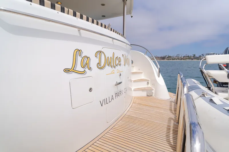 Slide: The Image of The 2010 Ocean Alexander 68 Motor Yacht is docked. It features elegant lettering on the side. - 18