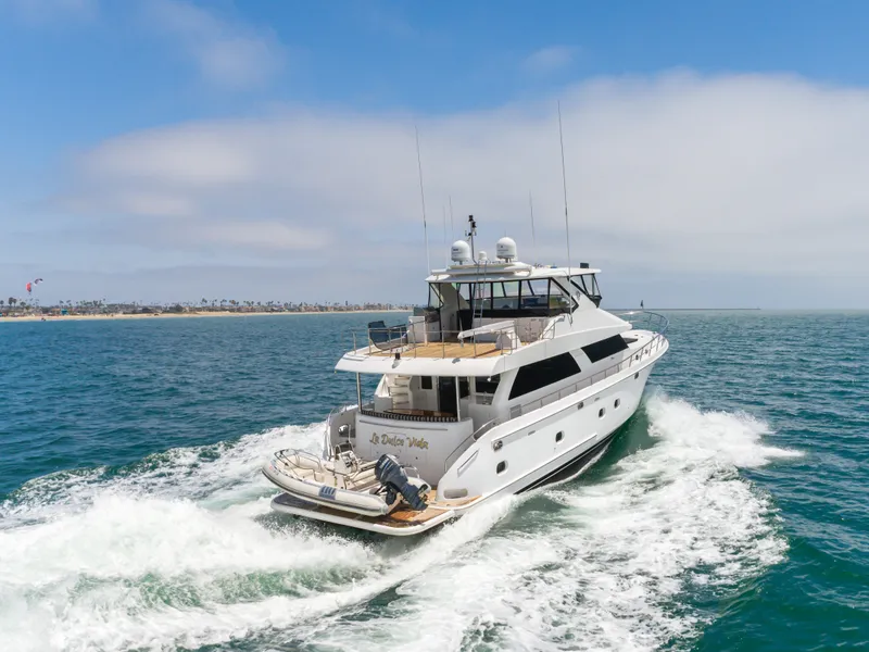 Slide: The Image of A luxurious 2010 Ocean Alexander 68 Motor Yacht cruising on the sea, surrounded by blue water. - 14