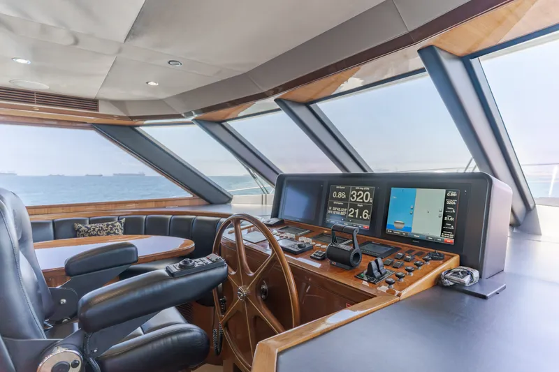 Slide: The Image of The cockpit of a 2010 Ocean Alexander 68 Motor Yacht with leather seating and modern instruments. - 33