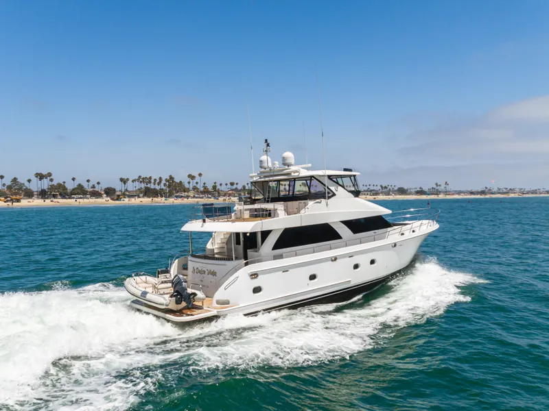 Slide: The Image of A luxurious 2010 Ocean Alexander 68 Motor Yacht cruising on the sea, surrounded by blue water. - 15