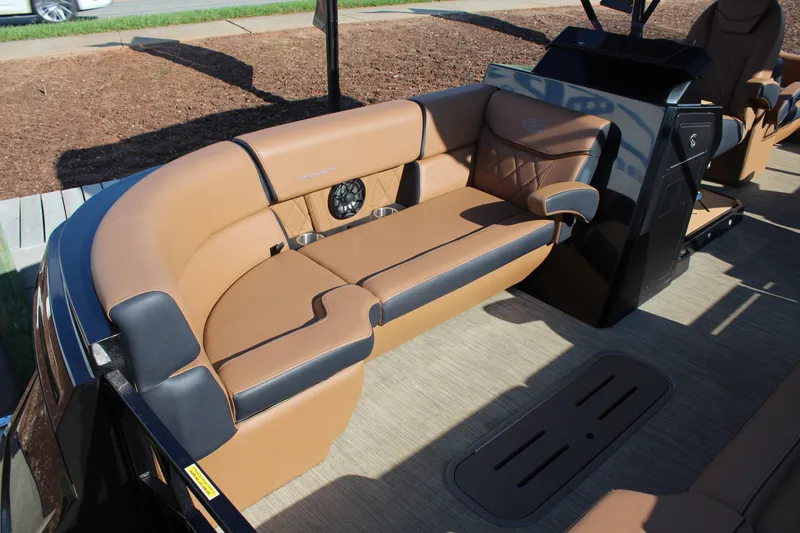 Slide: The Image of 2025 Veranda VTX 22RC boat interior with tan and black seating, luxurious design. - 13
