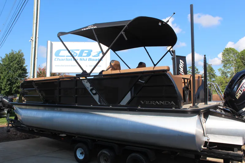Slide: The Image of 2025 Veranda VTX 22RC pontoon boat on trailer, displayed outdoors at Charlotte Ski Boats. - 3
