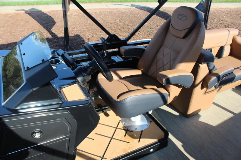 Slide: The Image of Luxurious interior of 2025 Veranda VTX 22RC pontoon boat with plush captain's chair. - 14