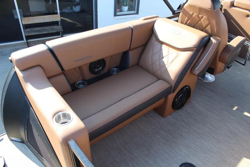 Slide: The Image of Luxurious seating on 2025 Veranda VTX 22RC boat with tan upholstery and cup holders. - 7