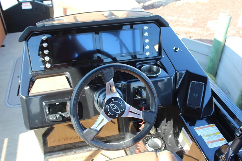 Slide: The Image of 2025 Veranda VTX 22RC boat dashboard with steering wheel and digital displays. - 15