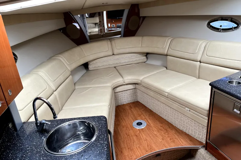 Slide: The Image of 2008 Formula 350 Sun Sport interior with beige seating and kitchenette. - 18