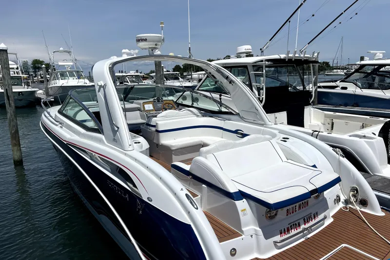 Slide: The Image of 2008 Formula 350 Sun Sport boat docked at marina, featuring sleek design and spacious seating. - 7