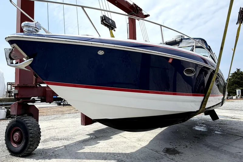Slide: The Image of 2008 Formula 350 Sun Sport boat on lift, showcasing sleek design and vibrant colors. - 14