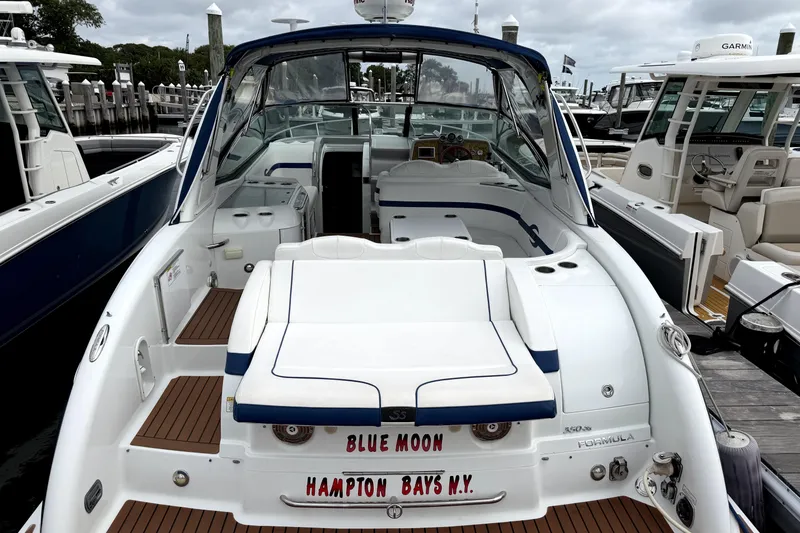 Slide: The Image of 2008 Formula 350 Sun Sport boat docked, featuring spacious seating and sleek design. - 8