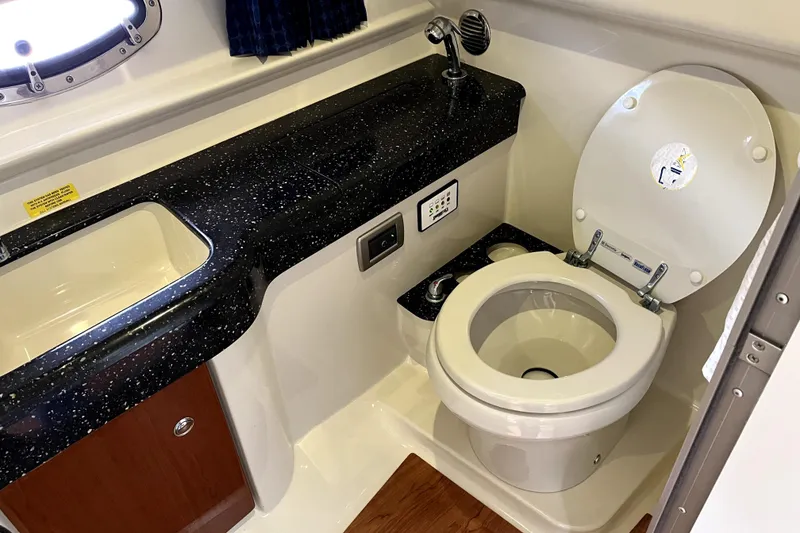 Slide: The Image of Luxury bathroom in 2008 Formula 350 Sun Sport boat with sleek black countertop. - 21