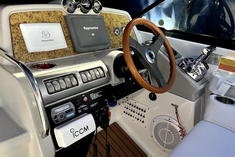 Slide: The Image of Cockpit of 2008 Formula 350 Sun Sport with steering wheel and navigation controls. - 10