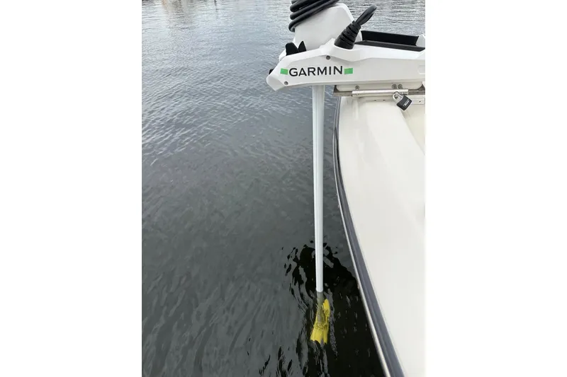 Slide: The Image of 2004 Pursuit 3070 Center Console with Garmin marine equipment in water. - 25