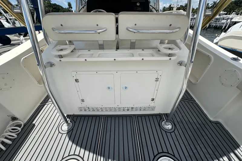 Slide: The Image of 2004 Pursuit 3070 Center Console boat interior with seating and storage compartments. - 5
