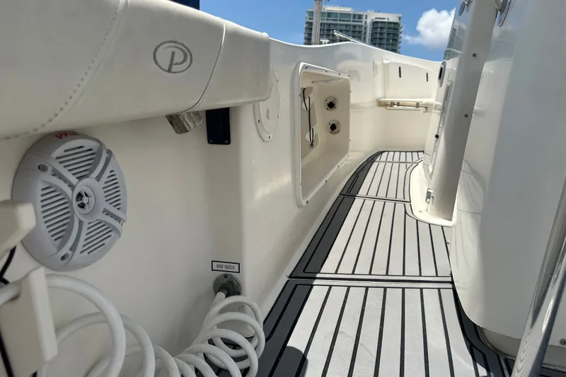 Slide: The Image of 2004 Pursuit 3070 Center Console boat interior with speaker and storage compartments. - 17