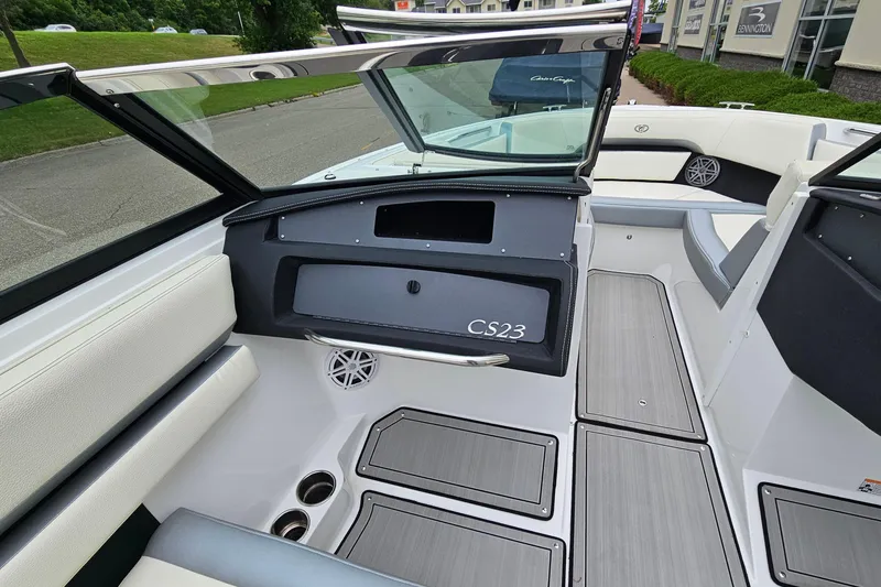 Slide: The Image of 2022 Cobalt CS23 boat interior with sleek seating and modern dashboard design. - 12