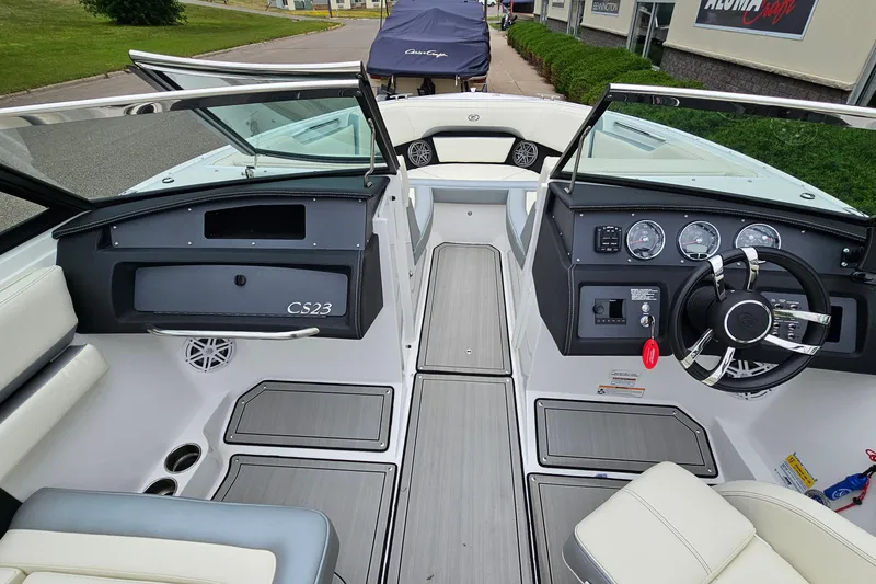 Slide: The Image of 2022 Cobalt CS23 boat interior with modern dashboard and seating. - 15
