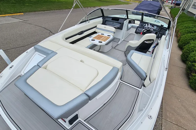 Slide: The Image of 2022 Cobalt CS23 boat interior with sleek seating and modern dashboard design. - 7