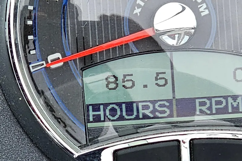 Slide: The Image of Close-up of a 2022 Cobalt CS23 boat tachometer displaying 85.5 hours. - 22