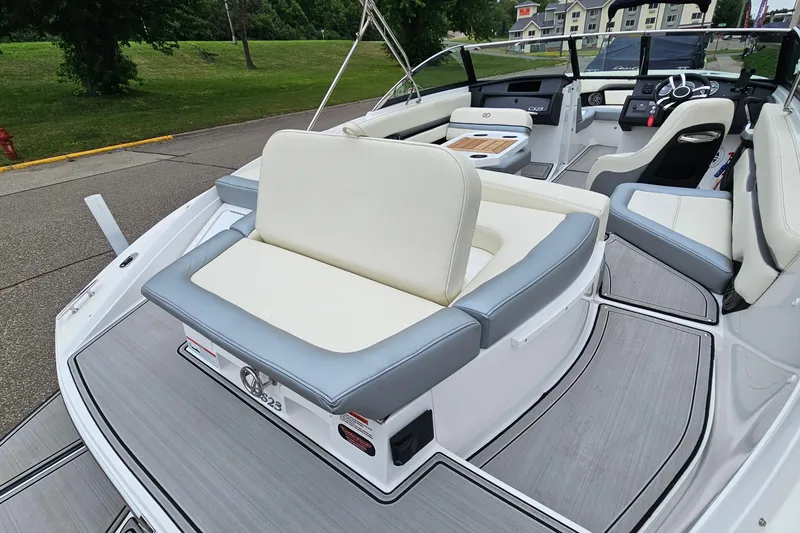 Slide: The Image of 2022 Cobalt CS23 boat interior with sleek seating and modern dashboard design. - 6