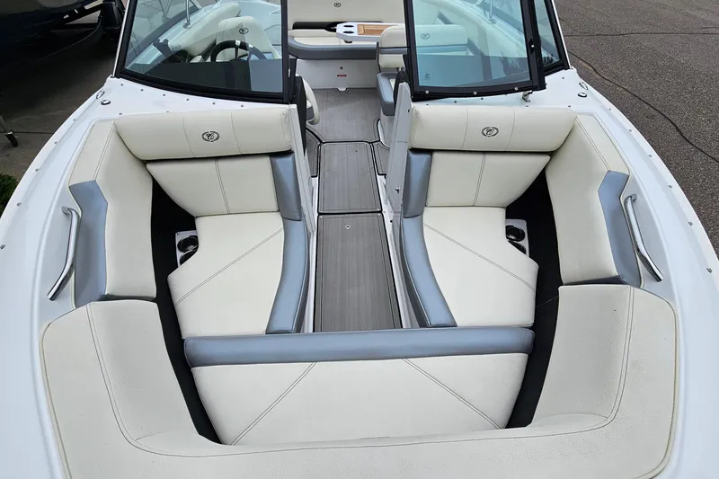 Slide: The Image of 2022 Cobalt CS23 boat interior with white and gray seating, open bow design. - 17