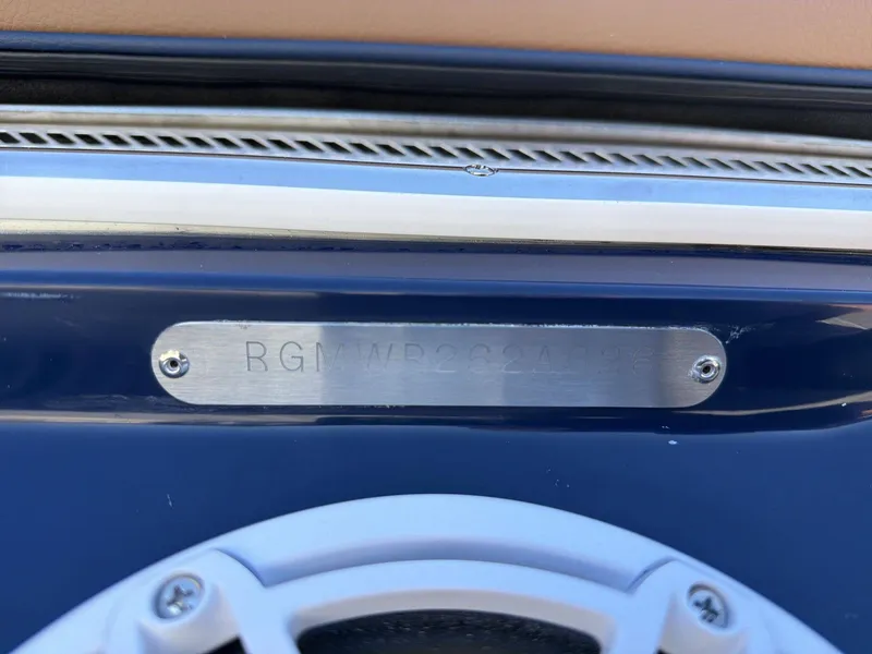 Slide: The Image of Close-up of a boat part with a metal plaque and a speaker. - 19