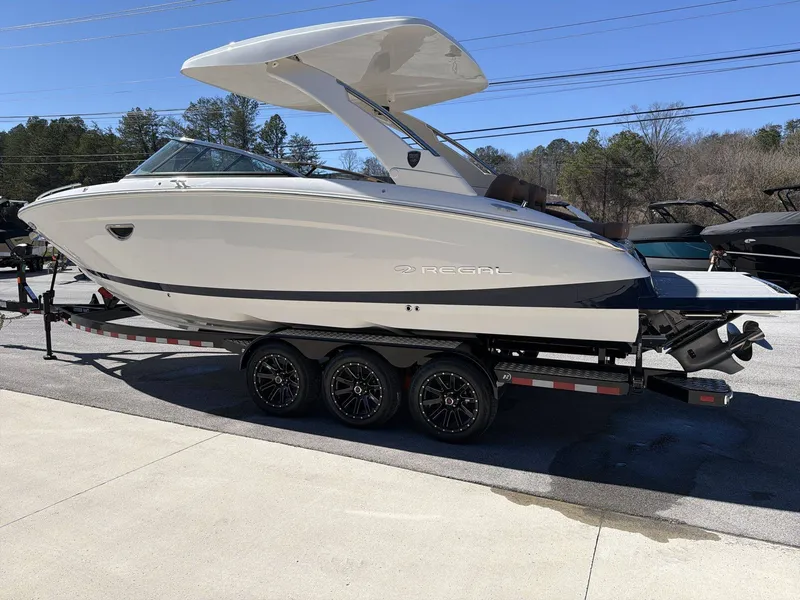 Slide: The Image of Regal LS9 2026: Sleek motorboat on a trailer, featuring modern design and curved roof. - 3
