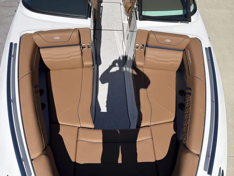 Slide: The Image of The image shows the cockpit of a Regal LS9 boat with brown upholstery and a modern design. - 13