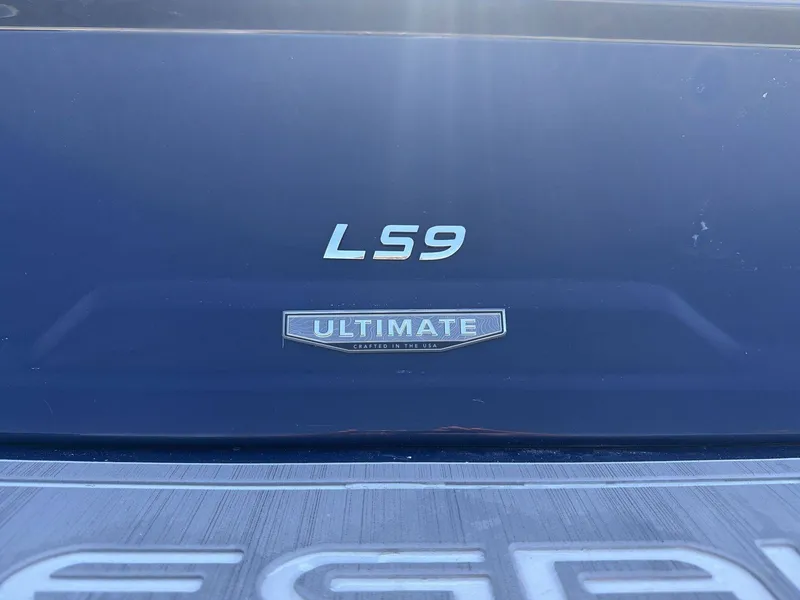 Slide: The Image of Close-up of a Regal LS9 boat's stern with "Ultimate" branding. - 15