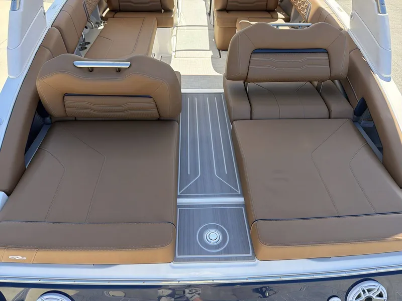 Slide: The Image of The image shows the luxurious cockpit of a Regal LS9 boat with brown leather seating. - 20