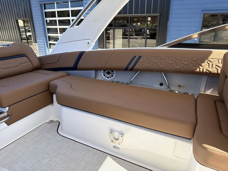 Slide: The Image of The image shows the luxurious cockpit of a Regal LS9 boat with elegant brown upholstery. - 4